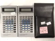 TWO TEXAS INSTRUMENTS CALCULATOR - ON WITH CASE