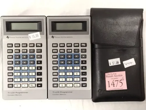 TWO TEXAS INSTRUMENTS CALCULATOR - ON WITH CASE